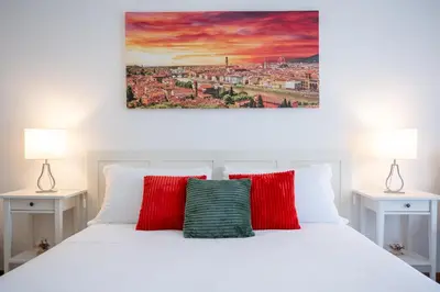 Letto o letti in una camera di Godi Fiorenza Suite - Duomo a 15 Minuti e Aeroporto a 4 Minuti con Tramvia T2