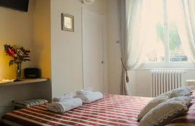 Letto o letti in una camera di B&B Isola d'Arno