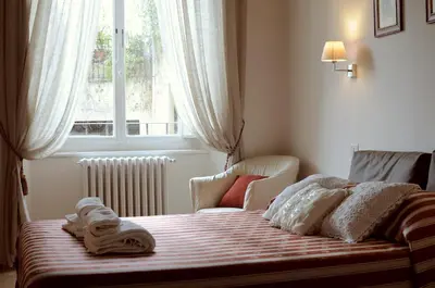 Letto o letti in una camera di B&B Isola d'Arno