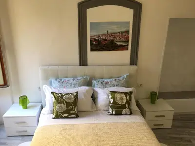 Letto o letti in una camera di La Tana Dei Leoni Affittacamere