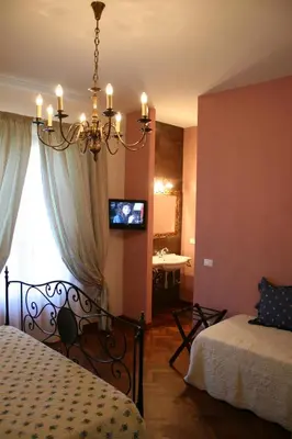 Letto o letti in una camera di Corte dei Galli B&B