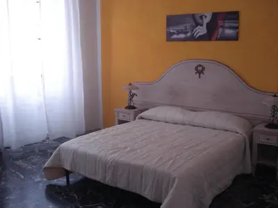 Letto o letti in una camera di Scala Apartment