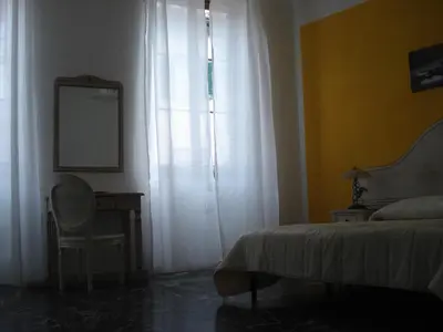 Letto o letti in una camera di Scala Apartment