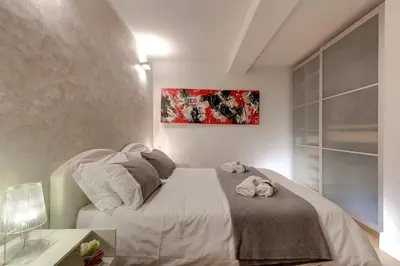 Letto o letti in una camera di Dado Suite by Mamo Florence