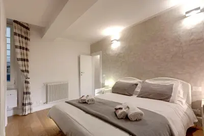 Letto o letti in una camera di Dado Suite by Mamo Florence
