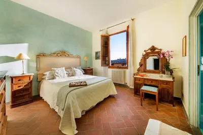 Letto o letti in una camera di Castello di Cafaggio