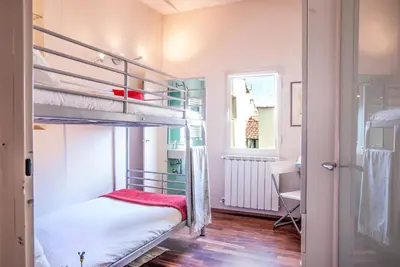 Letto o letti in una camera di Venus Roof Florence