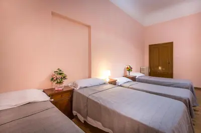 Letto o letti in una camera di Rooms77 Florence centro storico firenze