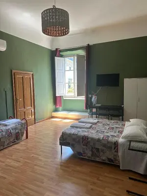 Letto o letti in una camera di Rooms77 Florence centro storico firenze
