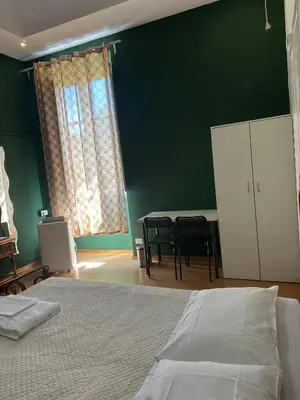 Letto o letti in una camera di Rooms77 Florence centro storico firenze