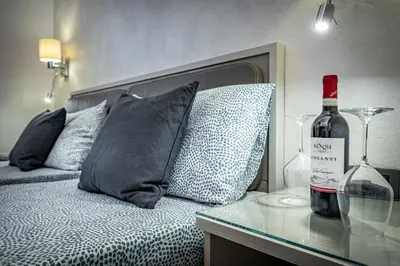 Letto o letti in una camera di B&B Lorenzo de' Medici