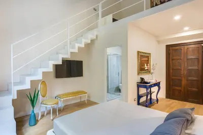 Letto o letti in una camera di Residenza D'Epoca Historia Luxury Boutique