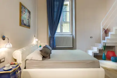 Letto o letti in una camera di Residenza D'Epoca Historia Luxury Boutique