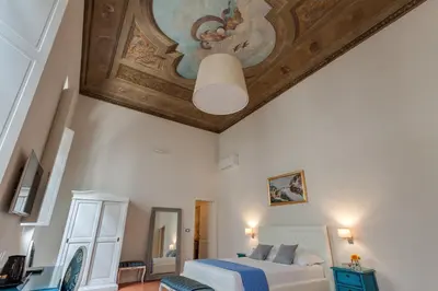 Letto o letti in una camera di Residenza D'Epoca Historia Luxury Boutique