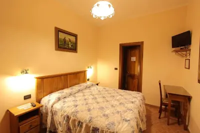 Letto o letti in una camera di Hotel Margaret