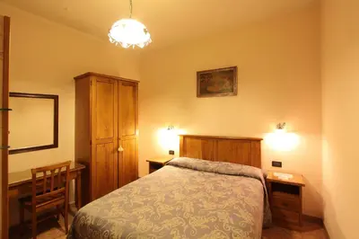 Letto o letti in una camera di Hotel Margaret