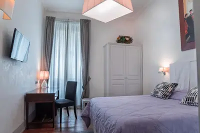 Letto o letti in una camera di Il Salotto Di Firenze