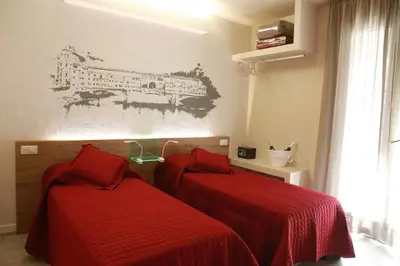 Letto o letti in una camera di B&B Santa Maria Novella