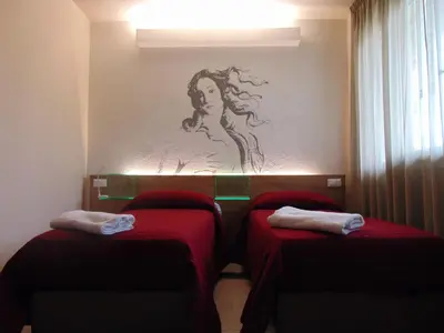 Letto o letti in una camera di B&B Santa Maria Novella
