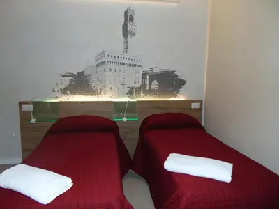 Letto o letti in una camera di B&B Santa Maria Novella