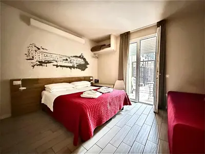 Letto o letti in una camera di B&B Santa Maria Novella