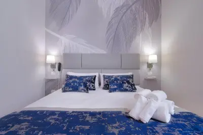 Letto o letti in una camera di Hotel Cosmos