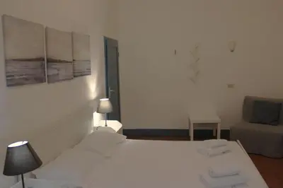 Letto o letti in una camera di Michelangelo's Relais