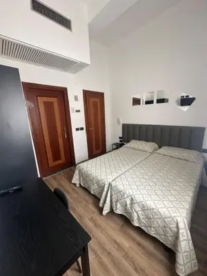 Letto o letti in una camera di Hotel Europa