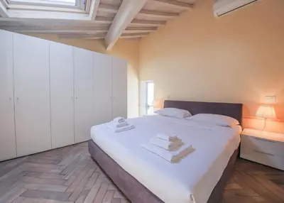 Letto o letti in una camera di Apartments Florence - Ricasoli Terrace