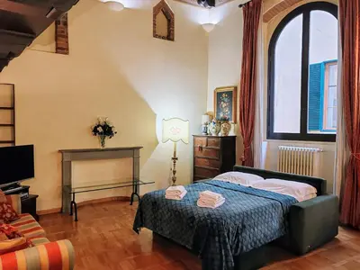 Letto o letti in una camera di Corno Florentine Apartment