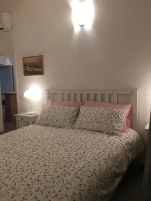 Letto o letti in una camera di Conte Canacci