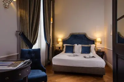 Letto o letti in una camera di Palazzo Roselli Cecconi