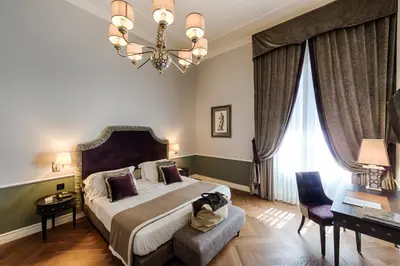 Letto o letti in una camera di Palazzo Roselli Cecconi