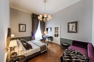 Letto o letti in una camera di Palazzo Roselli Cecconi