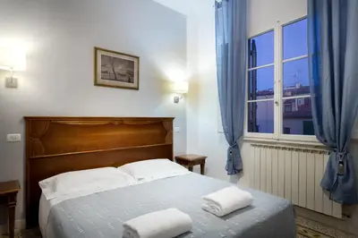 Letto o letti in una camera di CASA MICOL - Centro Ƒirenze