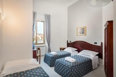 Letto o letti in una camera di CASA MICOL - Centro Ƒirenze