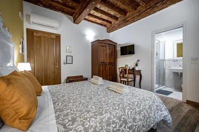 Letto o letti in una camera di La Stella d'Oro B&B