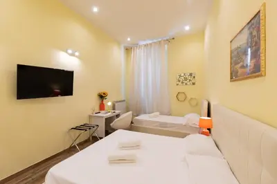 Letto o letti in una camera di SCALA GARDEN Apartment