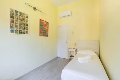 Letto o letti in una camera di SCALA GARDEN Apartment