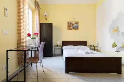 Letto o letti in una camera di SCALA GARDEN Apartment