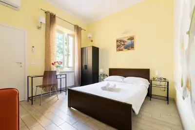 Letto o letti in una camera di SCALA GARDEN Apartment