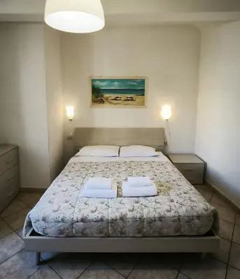 Letto o letti in una camera di Casa Naldi