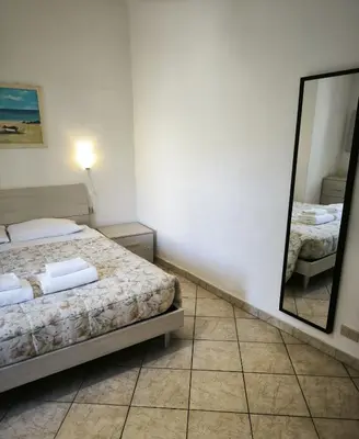 Letto o letti in una camera di Casa Naldi