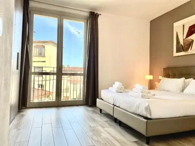 Letto o letti in una camera di Borgo Guelfo I