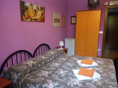 Letto o letti in una camera di Soggiorno Petrarca