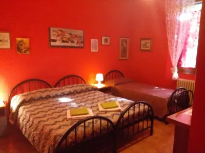 Letto o letti in una camera di Soggiorno Petrarca