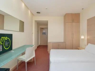 Letto o letti in una camera di B&B HOTEL Calenzano First