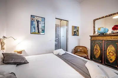 Letto o letti in una camera di YiD Cimabue
