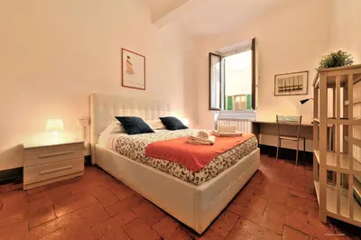 Letto o letti in una camera di Wine Apartments Florence Colorino