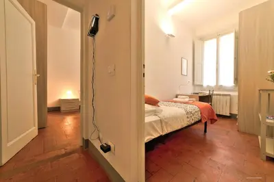 Letto o letti in una camera di Wine Apartments Florence Colorino